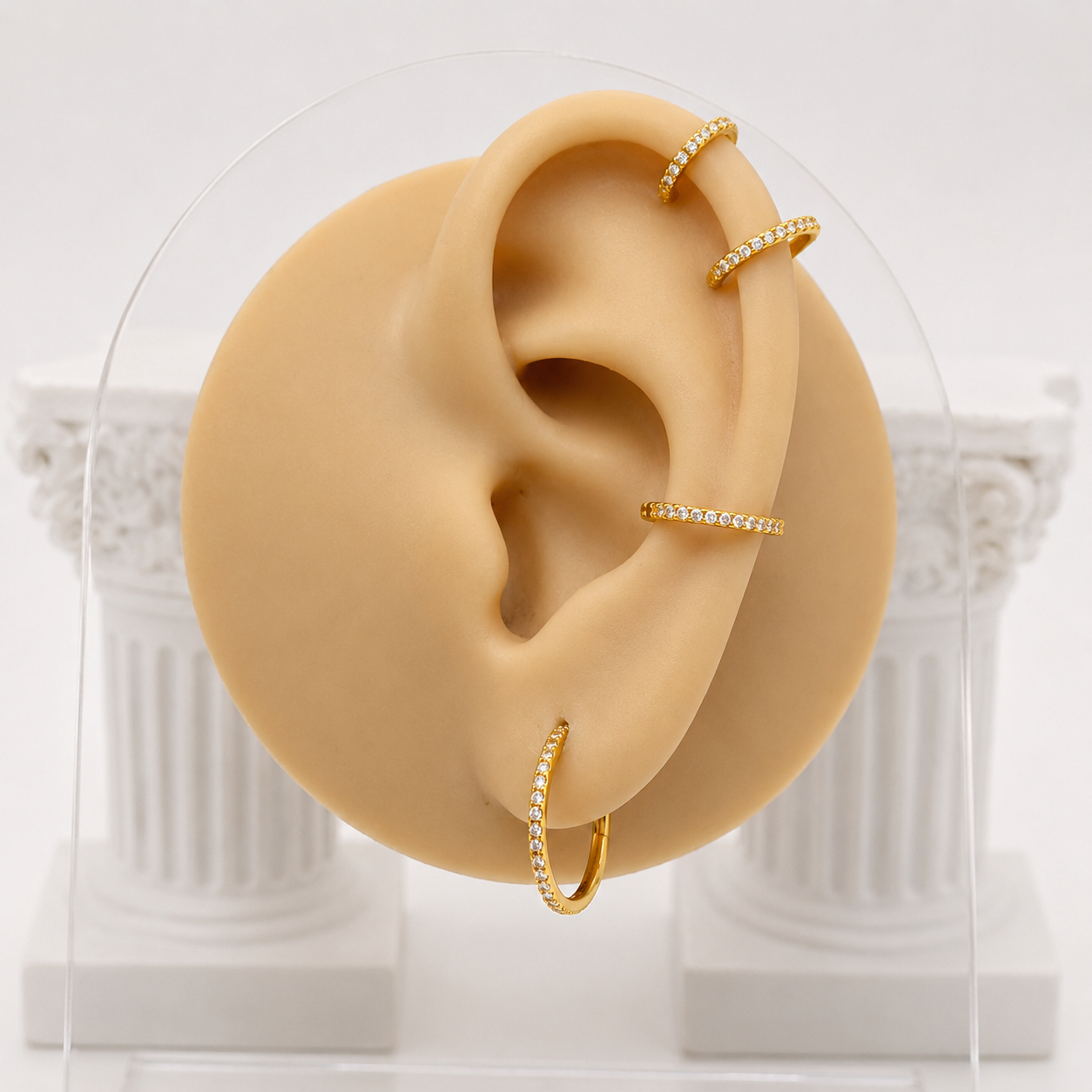 Zircon helix hoop in gold