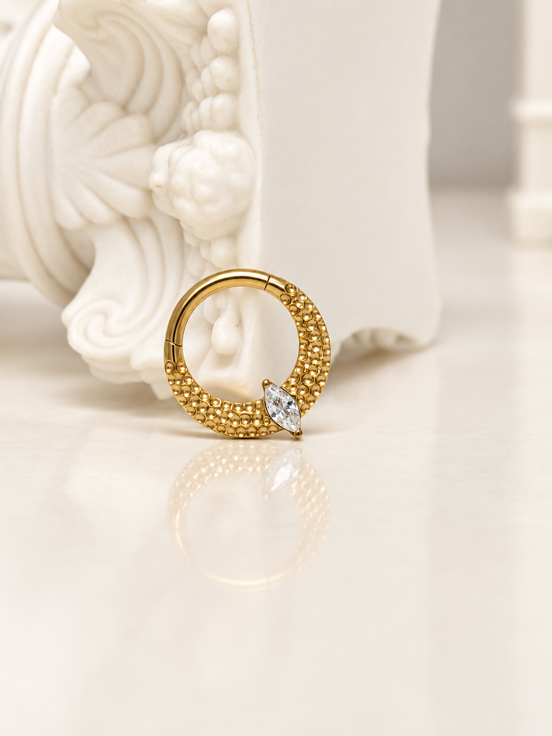 Ornate teardrop daith in gold